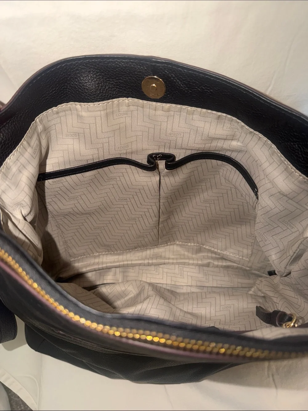 Lodis Black Leather Crossbody Bag with Tassel Accents